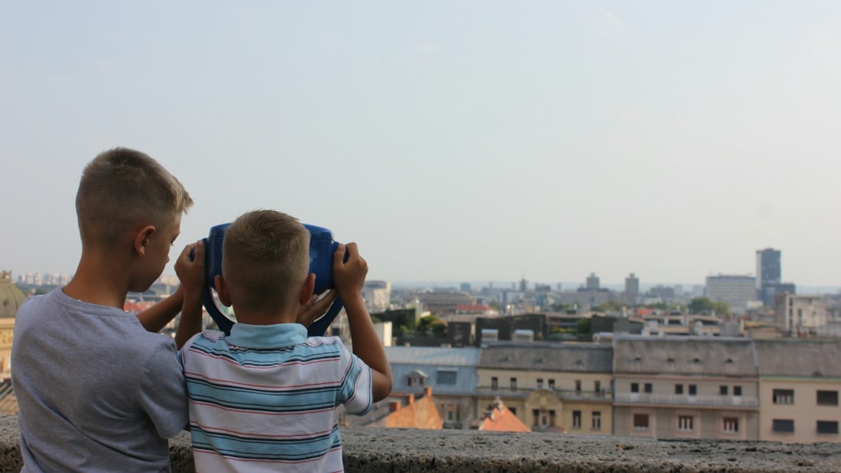 Two boys watching Zagreb.